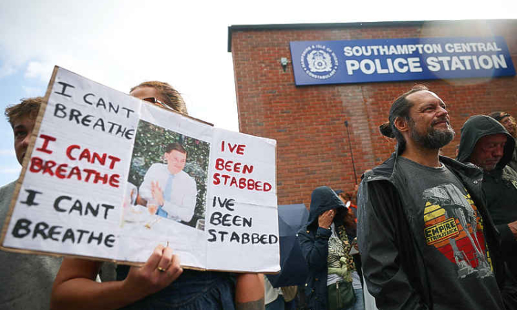 UK police under pressure after  dying student was handcuffed